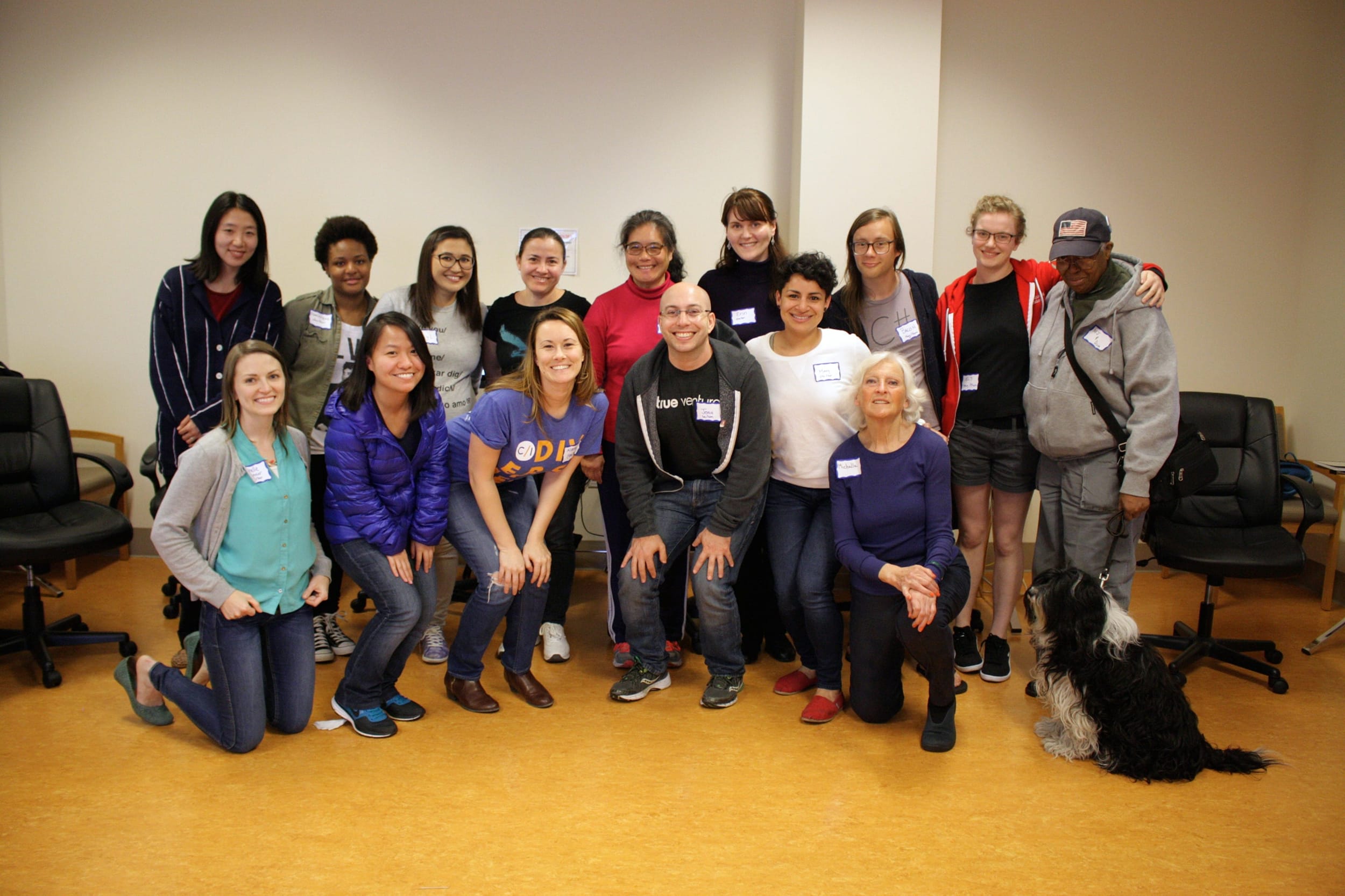 Fifteen participants, mostly women, gathered after a workshop.